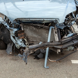 Car front end smashed after a work accident
