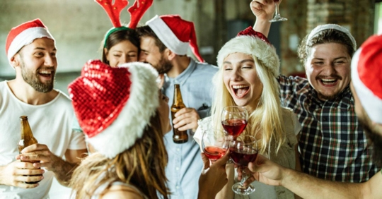 people drinking in warehouse at holiday party