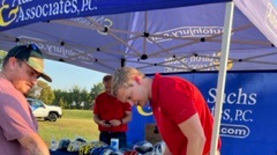 KY3 and the City of Springfield Block Party - Will Sachs Fitting a Bike Helmet at Chesterfield Park Photo