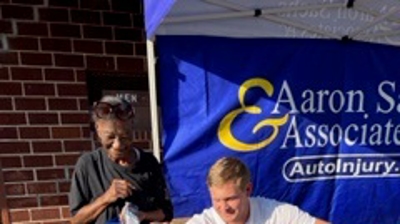 KY3 and the City of Springfield Block Party - Will Sachs Fitting a Bike Helmet at Smith Park Photo