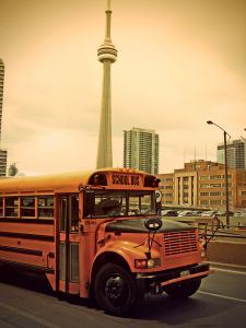 Photo of a school bus driving through the city