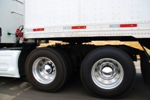 close up photo of the wheels on a semi truck