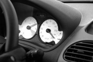 black and white image of a speedometer