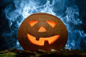 10640612-halloween-pumpkin-on-leafs-with-blue-smoke.jpg