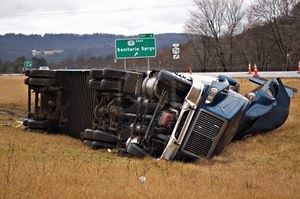 2940620-a-tractor-trailer-on-its-side-in-the-median-after-a-roll-over-accident.jpg