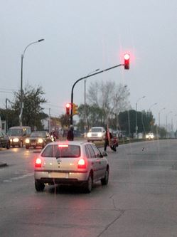 rear headlights on a small car, driving in cloudy weather