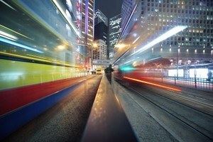 7412023-fast-moving-bus-lights-blurred-over-modern-city-background.jpg
