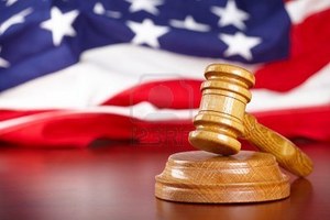 8887440-judges-wooden-gavel-with-usa-flag-in-the-background.jpg